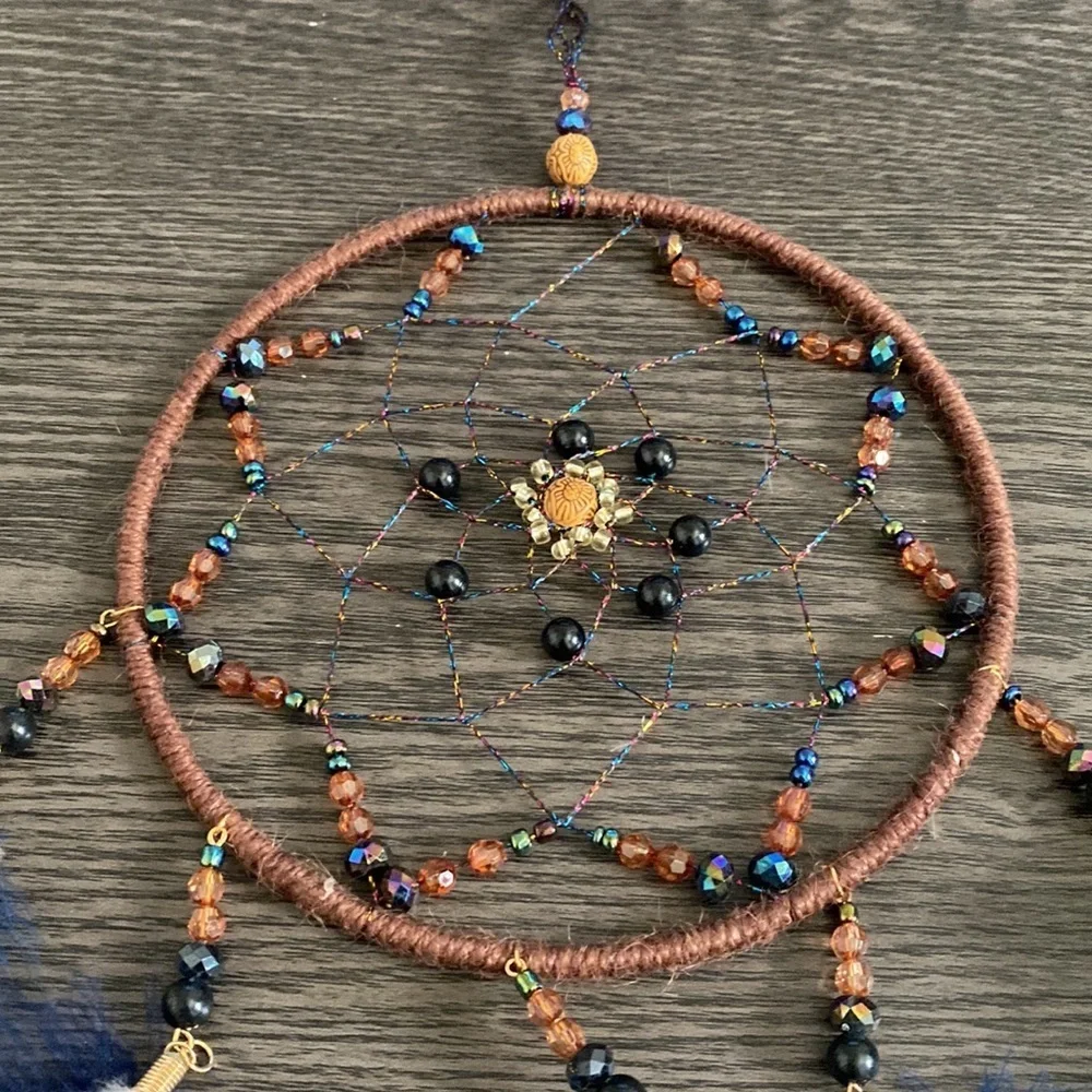Dream catcher. Blue and tan feathers beaded. Beautiful!